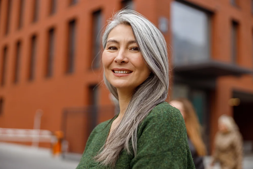 A smiling woman outdoors