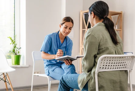 A healthcare professional talking with a patient