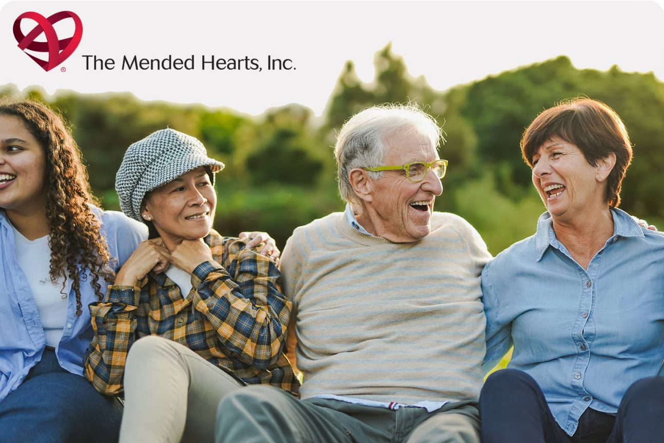 The Mended Hearts, Inc. – a group of smiling seniors sitting outdoors